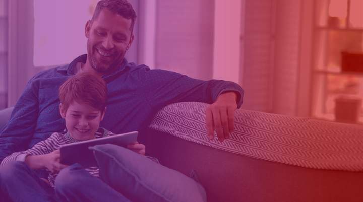 Image of family watching an iPad