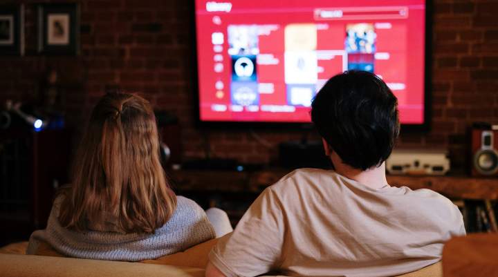 woman and man watching tv