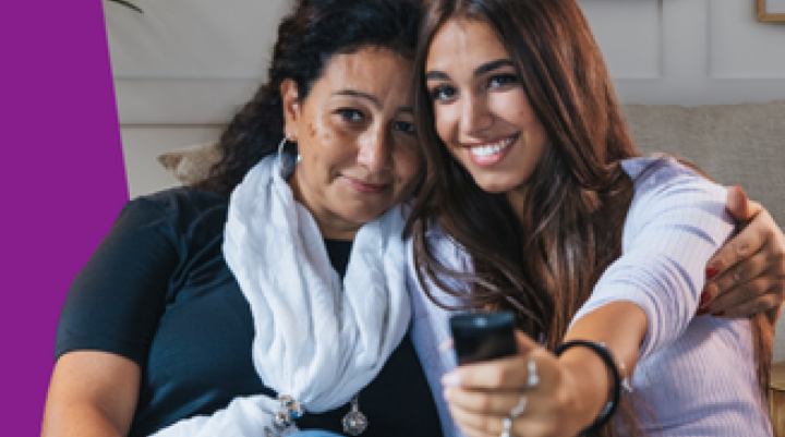 A mother and daughter in front of a television