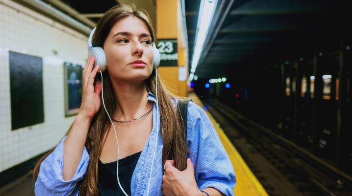 A woman listening to a podcast