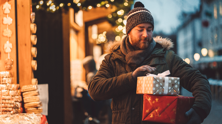 Man holding christmas presents 