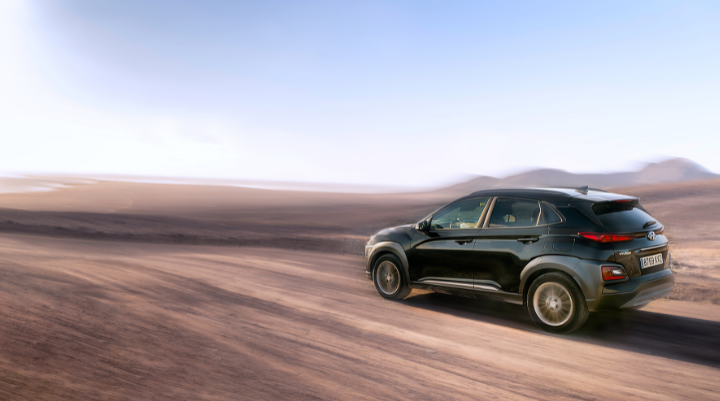 Car driving through desert