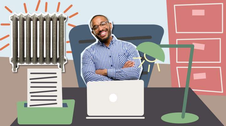 A man smiling with his arms crossed sitting in a fictional office.