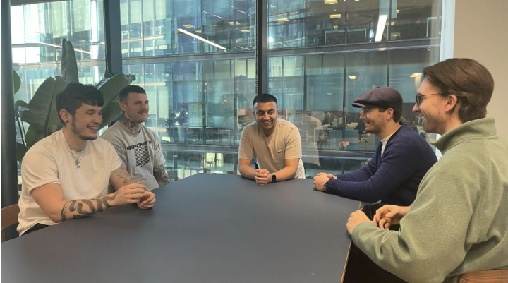 men gathered on the table conversing 