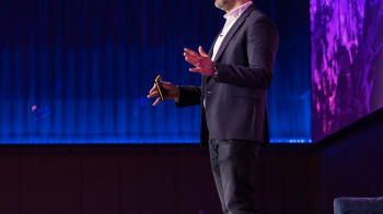 Jon Mew speaking on stage at IAB event