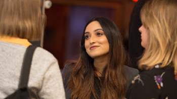 Policy stock image of woman looking at a person
