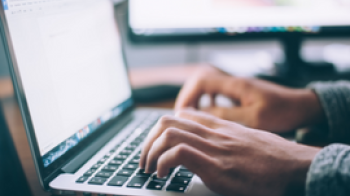 Person typing on a laptop